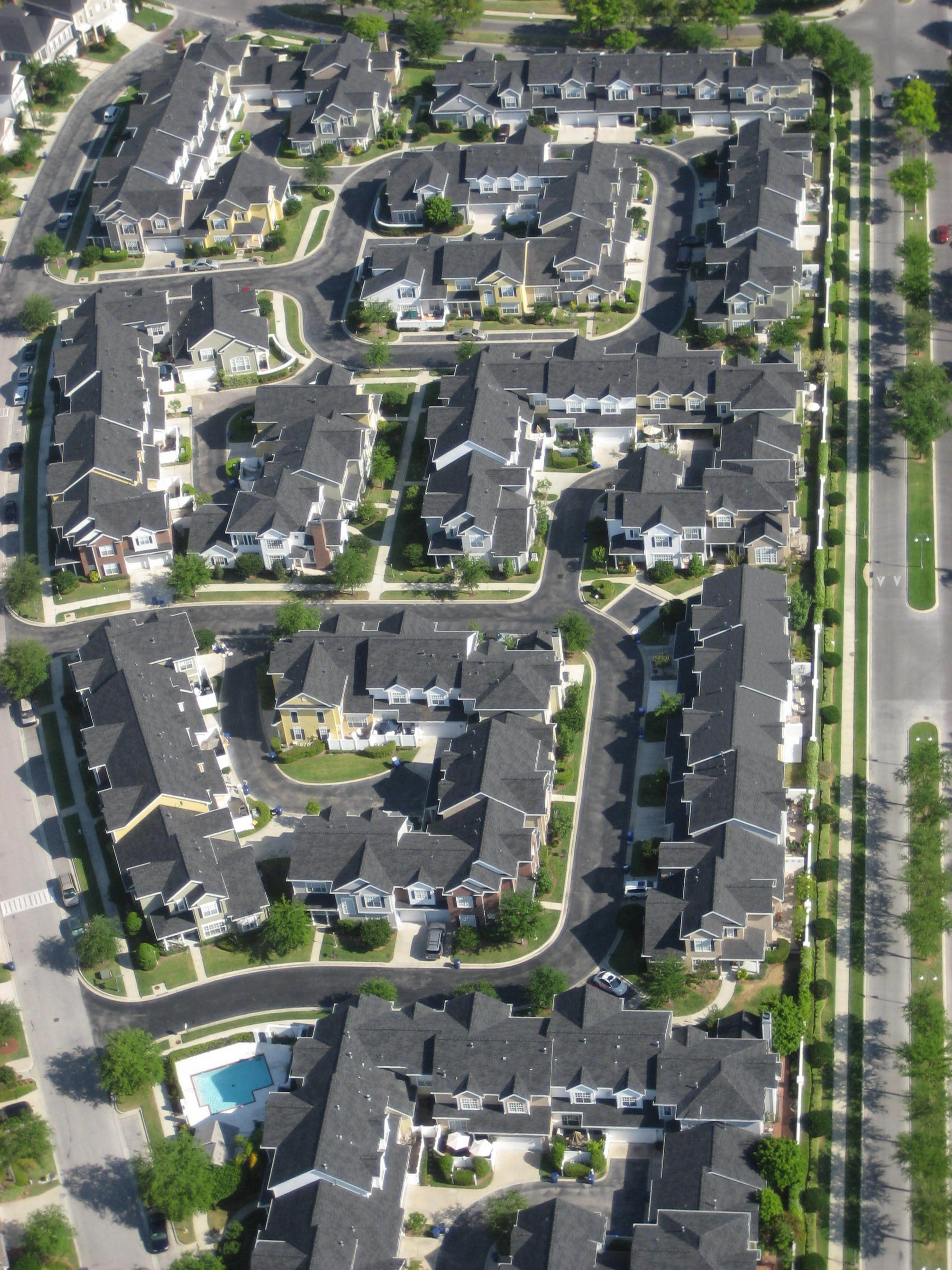 An overhead aerial view of a residential neighborhood — the kind of premise-level geography GIS makes legible.